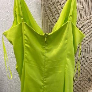 Neon green slip dress with high slit